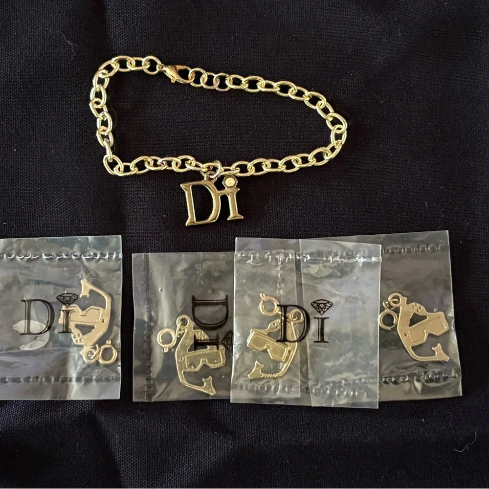 Diamond International Gold Charm Bracelet Set. 8 bracelets multiple charms. - Picture 6 of 15